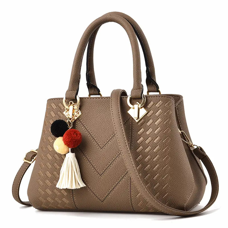 Luxury women handbags brown woven pu leather crossbody bag with gold-tone hardware and colorful pom-pom tassel charm