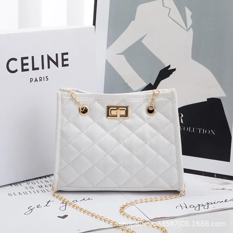 White quilted mini chain shoulder bag with rhombus pattern, gold-tone hardware, and chain strap.