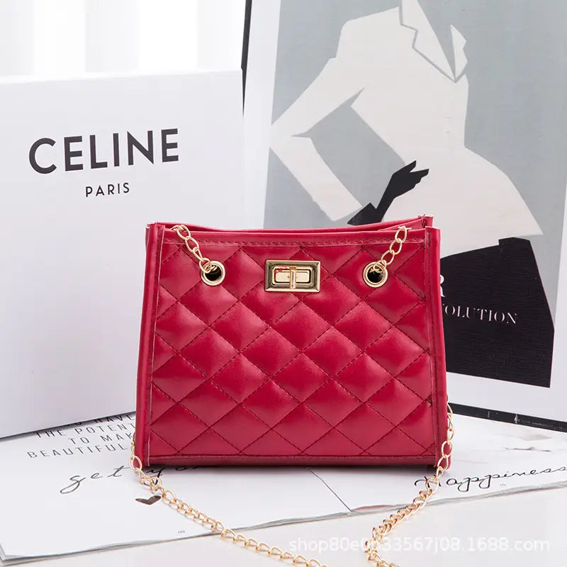A glossy red quilted mini chain shoulder bag with rhombus pattern gold-tone hardware and a chain strap.