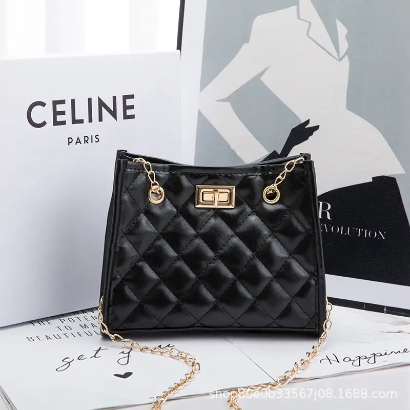 Black quilted mini chain shoulder bag with gold-tone chain strap and clasp in a rhombus small square design.