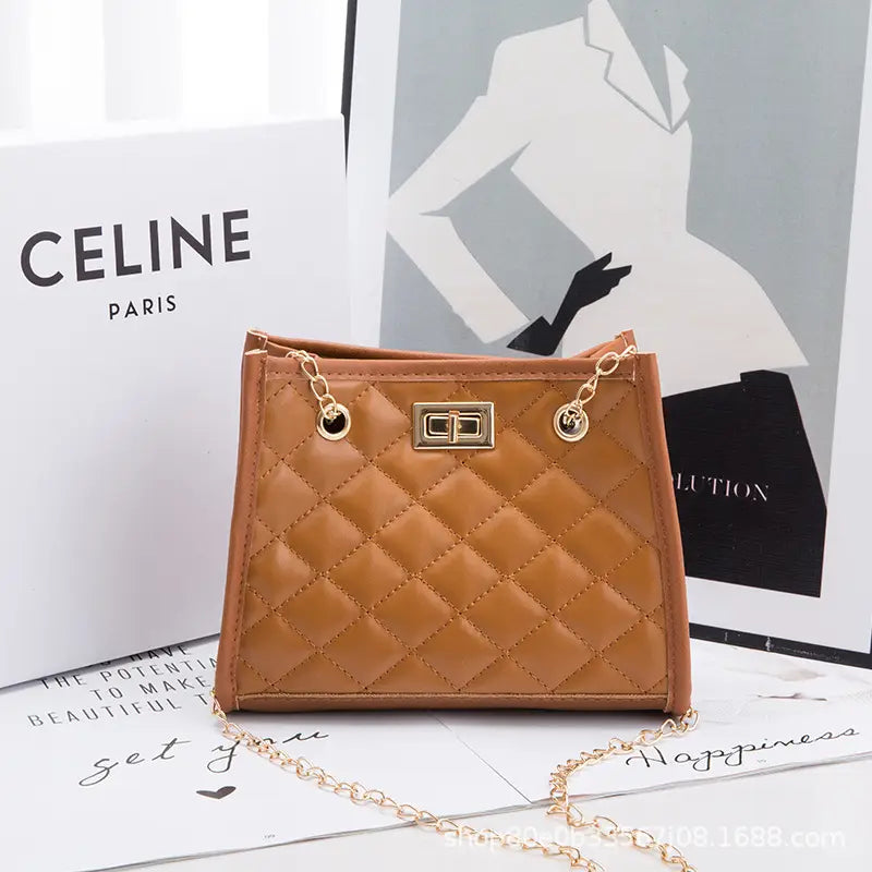 Tan quilted mini chain shoulder bag with rhombus pattern small square shape gold-tone hardware and chain strap.