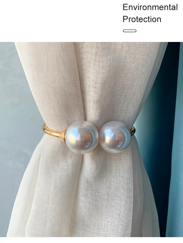 Elegant gold-toned pearl curtain tieback featuring two lustrous pearl-like spheres and a durable alloy spring buckle.