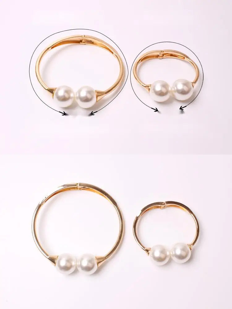 Gold-toned alloy pearl curtain tieback with elegant spring buckle and two smooth round white pearls set on each side.