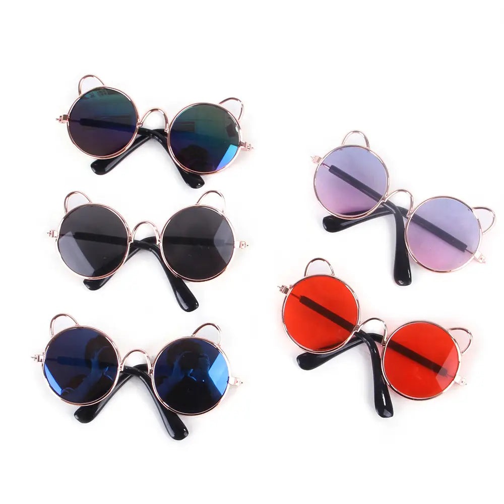 Rose gold cat ear pet sunglasses featuring round mirrored lenses in blue black and red with rose gold metal frames.