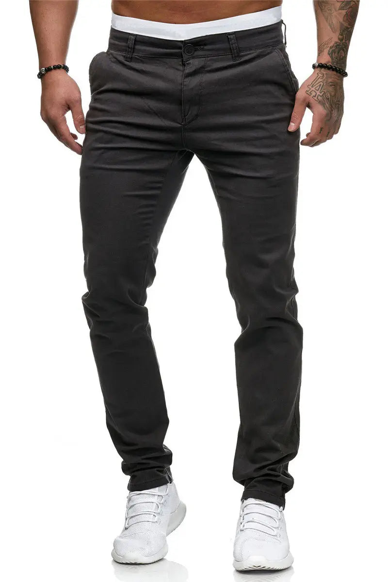 Men’s casual slim fit chinos in black with a slim fit, straight leg cut, and visible stitching details.
