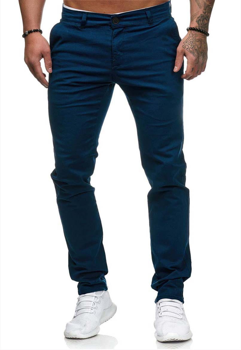 Dark blue slim fit chinos for men featuring a classic five pocket design and belt loops.