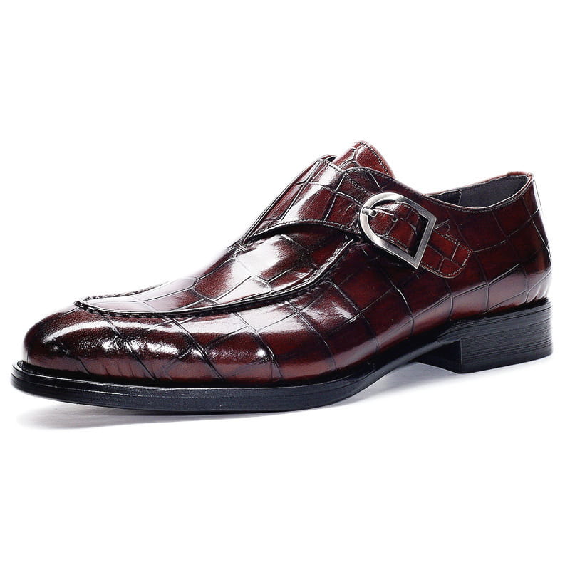 Classic men’s leather formal dress loafers in burgundy crocodile-embossed leather with silver monk strap buckle.