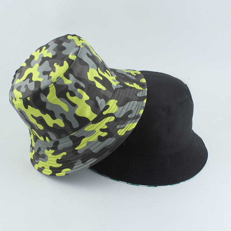 a reversible camouflage fisherman hat featuring a vibrant neon yellow and gray camouflage bucket hat design with a black base