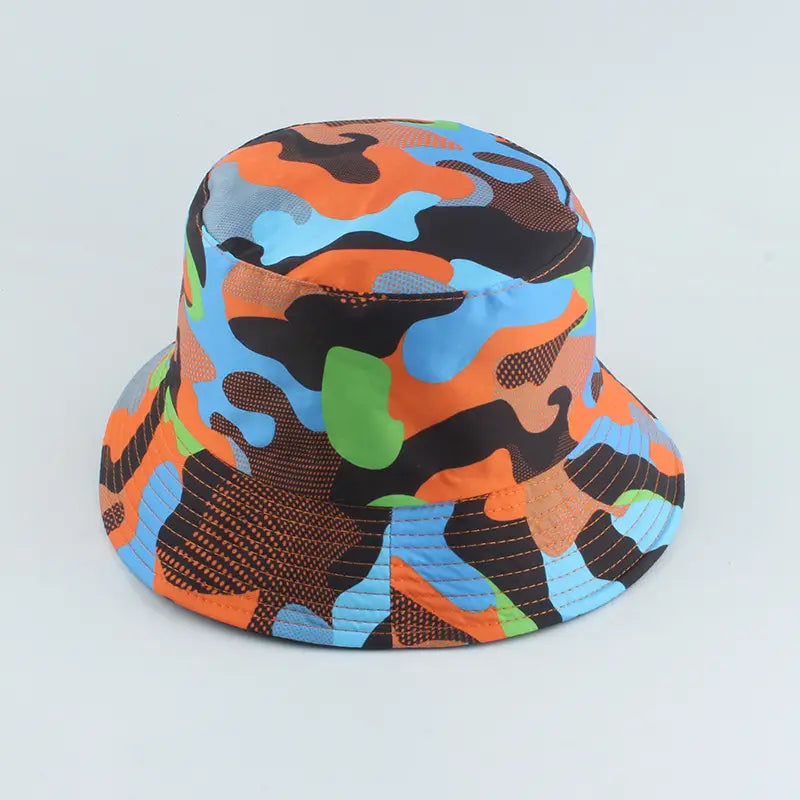 A vibrant orange blue and green camouflage-patterned reversible fisherman hat with a textured fabric finish.