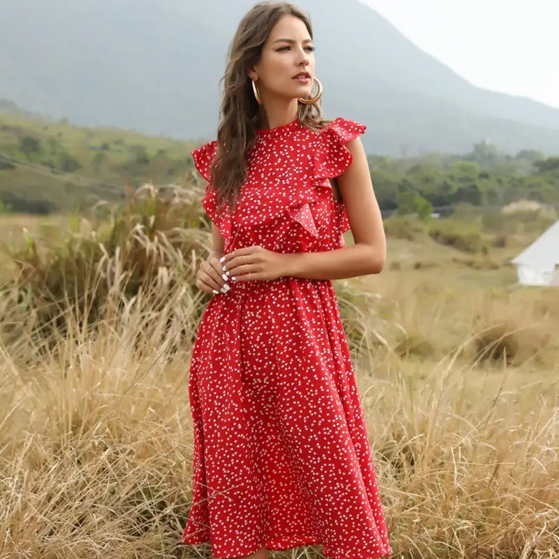 A vibrant red floral chiffon ruffle midi dress with delicate white floral patterns and ruffled shoulder details.