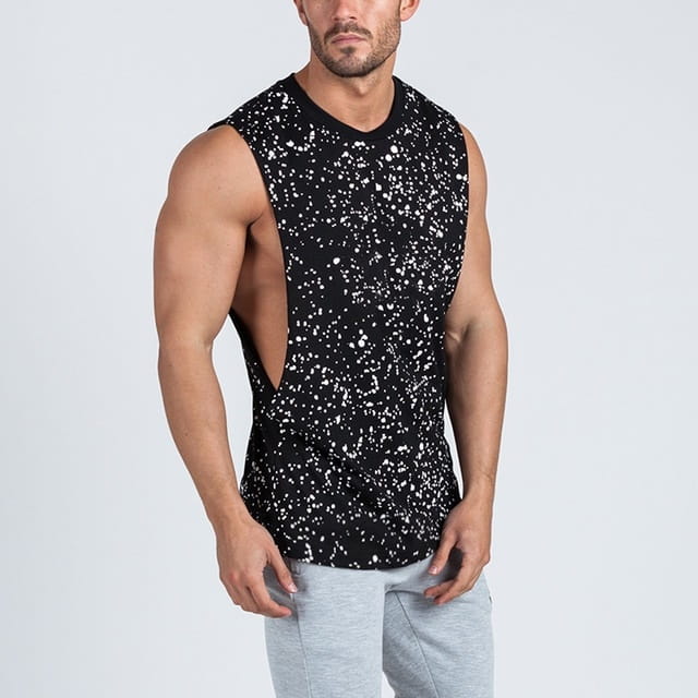 Men’s lightweight athletic muscle tank top in black with white splatter pattern featuring a sleeveless design and side cutout for enhanced ventilation and mobility.