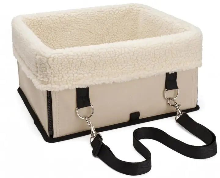 Beige elevated dog car seat with plush white fleece lining and black straps for portable waterproof pet booster use.