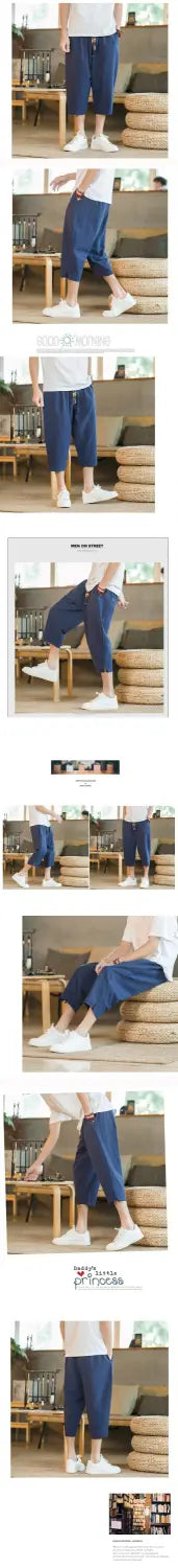 navy blue cotton shorts with a relaxed fit and rolled cuffs designed as men linen capri pants with a drawstring waistband.