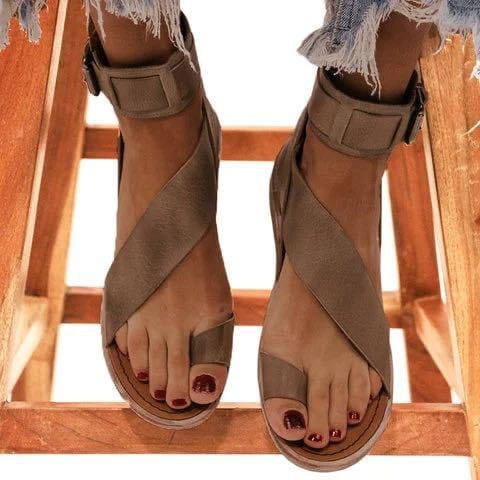 tan suede plus size women’s flat roman strappy sandals featuring cross straps and ankle buckles