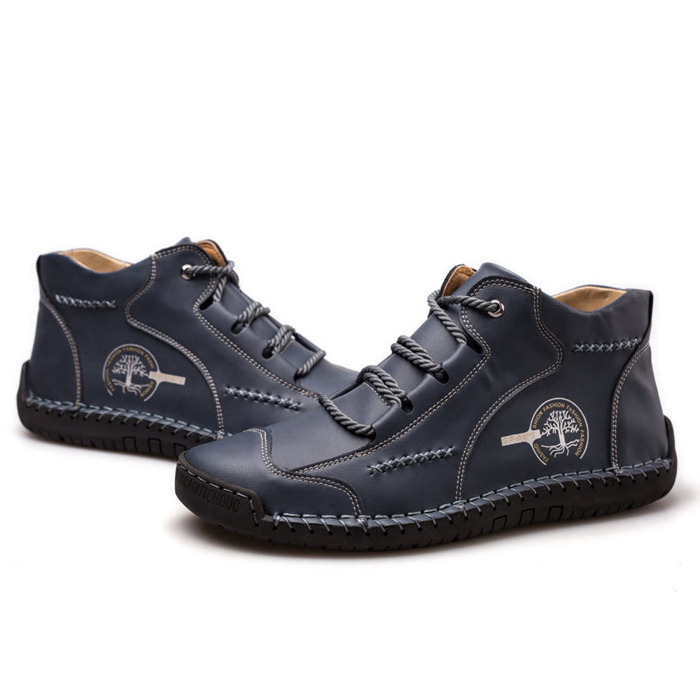 Dark blue leather high top sneakers featuring hand stitched contrasting stitching and a tree emblem patch.