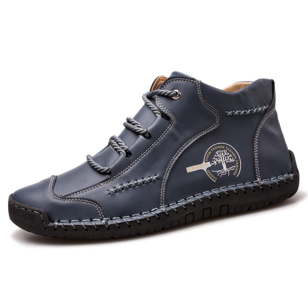 Dark blue leather high-top sneaker featuring visible stitching and a circular tree logo on the side designed as a hand-stitched vintage leather boot.