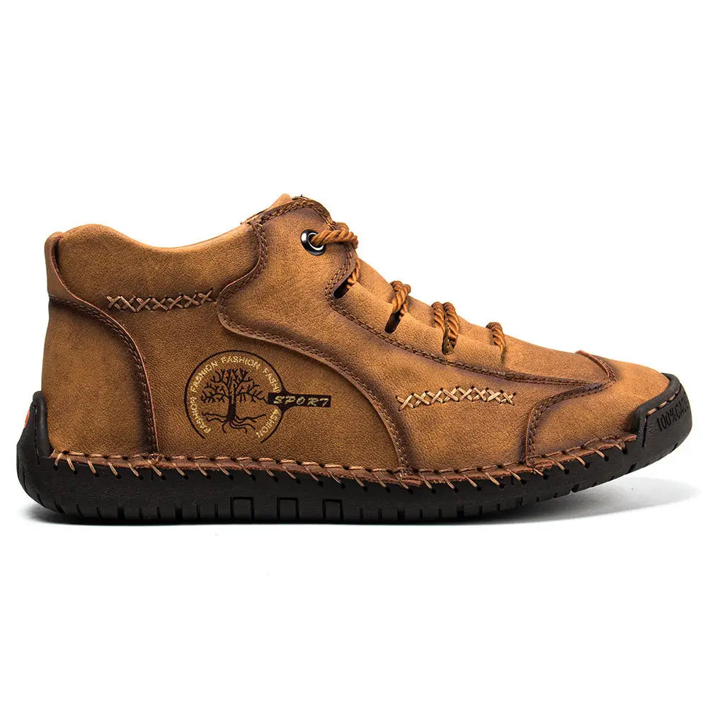 Leather boots hand stitched vintage high top sneakers in tan suede with brown laces black rubber sole and circular tree logo patch on the side.