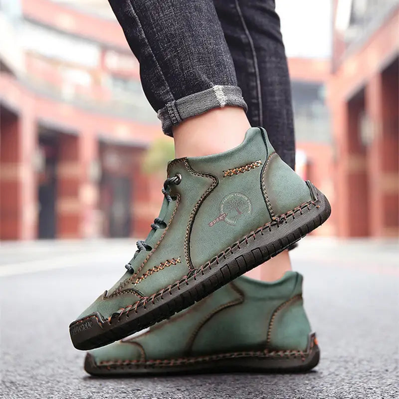 Olive green leather ankle boots with brown stitching and a rugged sole featured in leather boots hand stitched vintage high top sneakers.