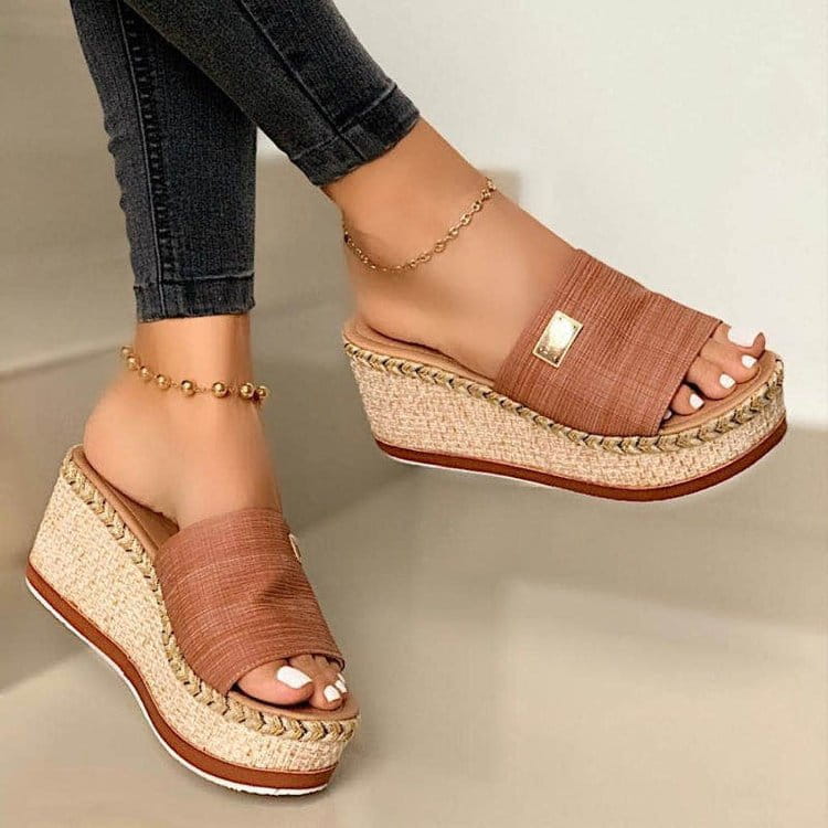 Tan espadrille wedge sandals with denim textured fabric strap and gold tone metal accent.