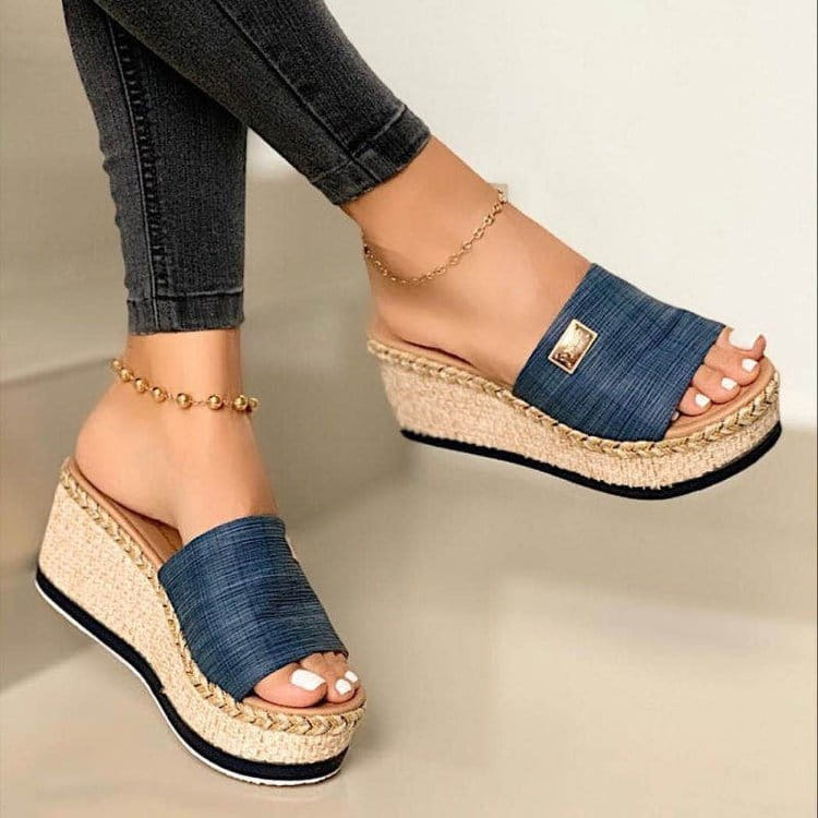 Blue denim strap espadrille wedge sandals with a braided sole and gold-tone metal accent.