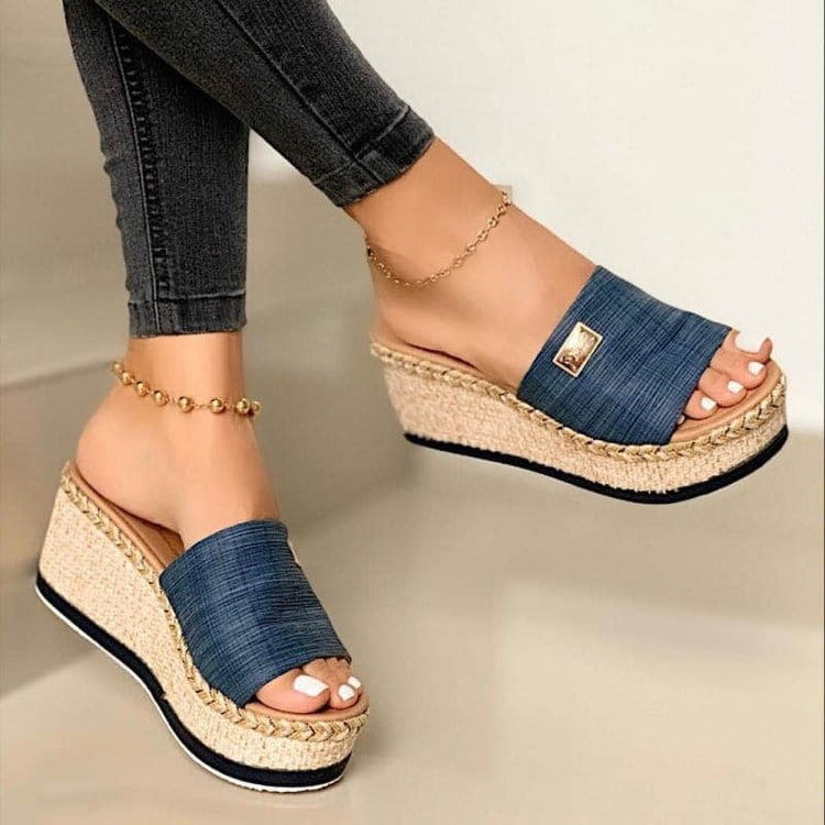 Blue denim strap espadrille wedge sandals featuring a braided jute sole and gold-tone metal accent.