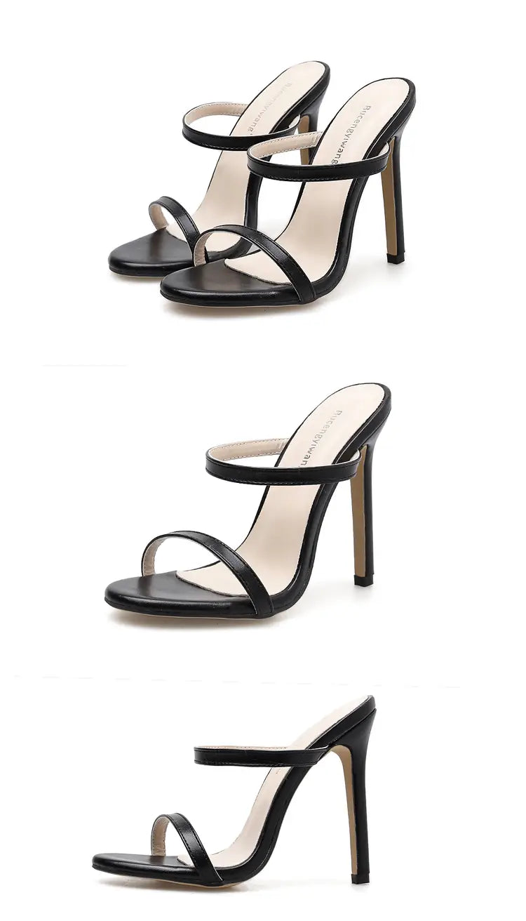 black leather minimalist strappy stiletto sandals with slender high heels shown from the back side