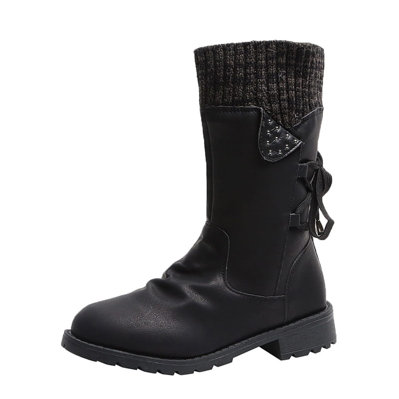 Black faux leather women winter snow ankle boot with a knitted cuff and decorative studded flap suitable for cold weather.