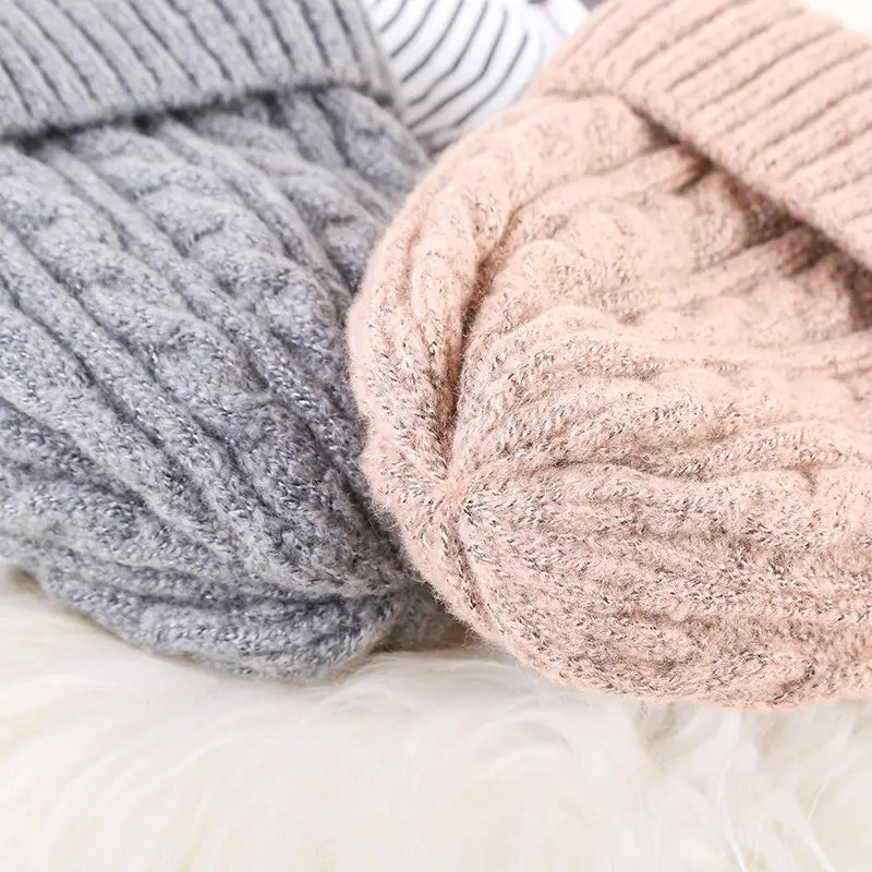 soft chunky-knit cable knit beanie hat in muted gray and blush pink fleece lined for winter warmth