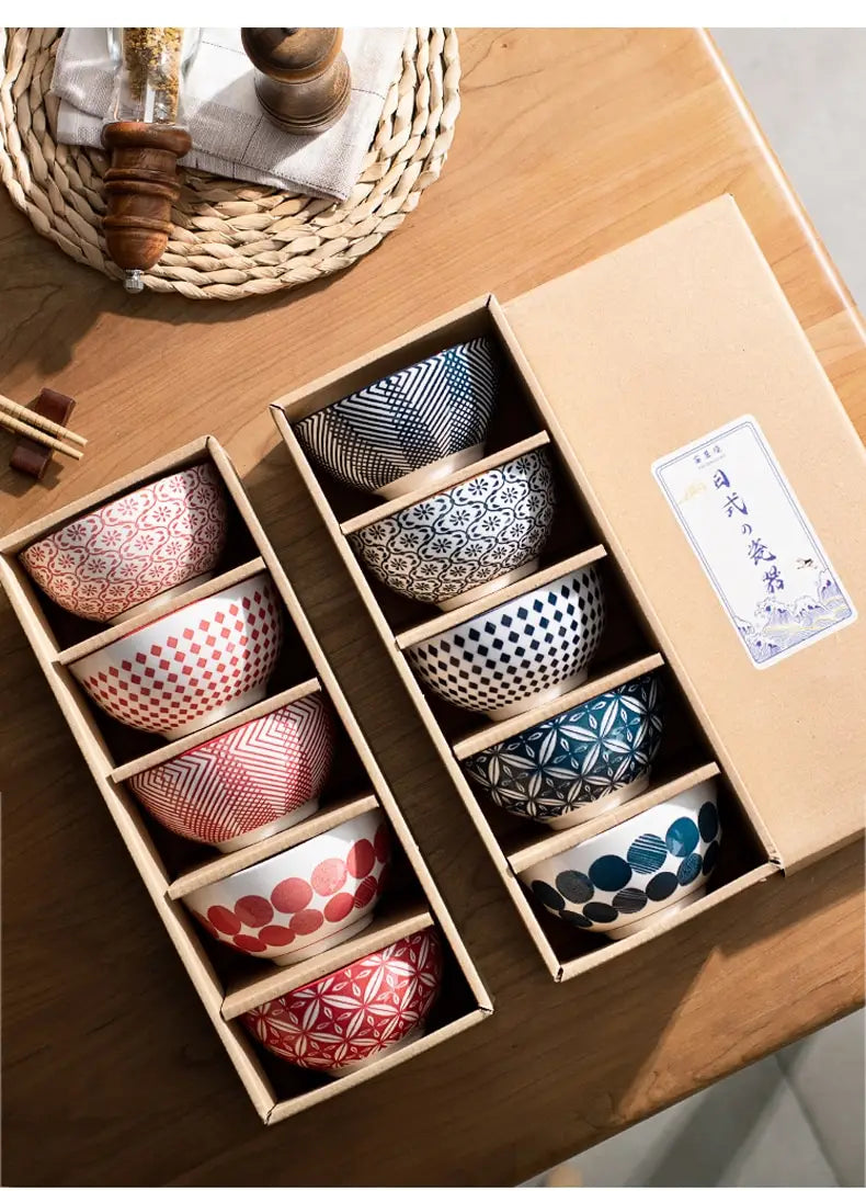 Set of six ceramic bowls in a wooden box featuring unique geometric and floral patterns in red, pink, black, white, and blue for the ceramic bowl set 5 piece Japanese floral porcelain.