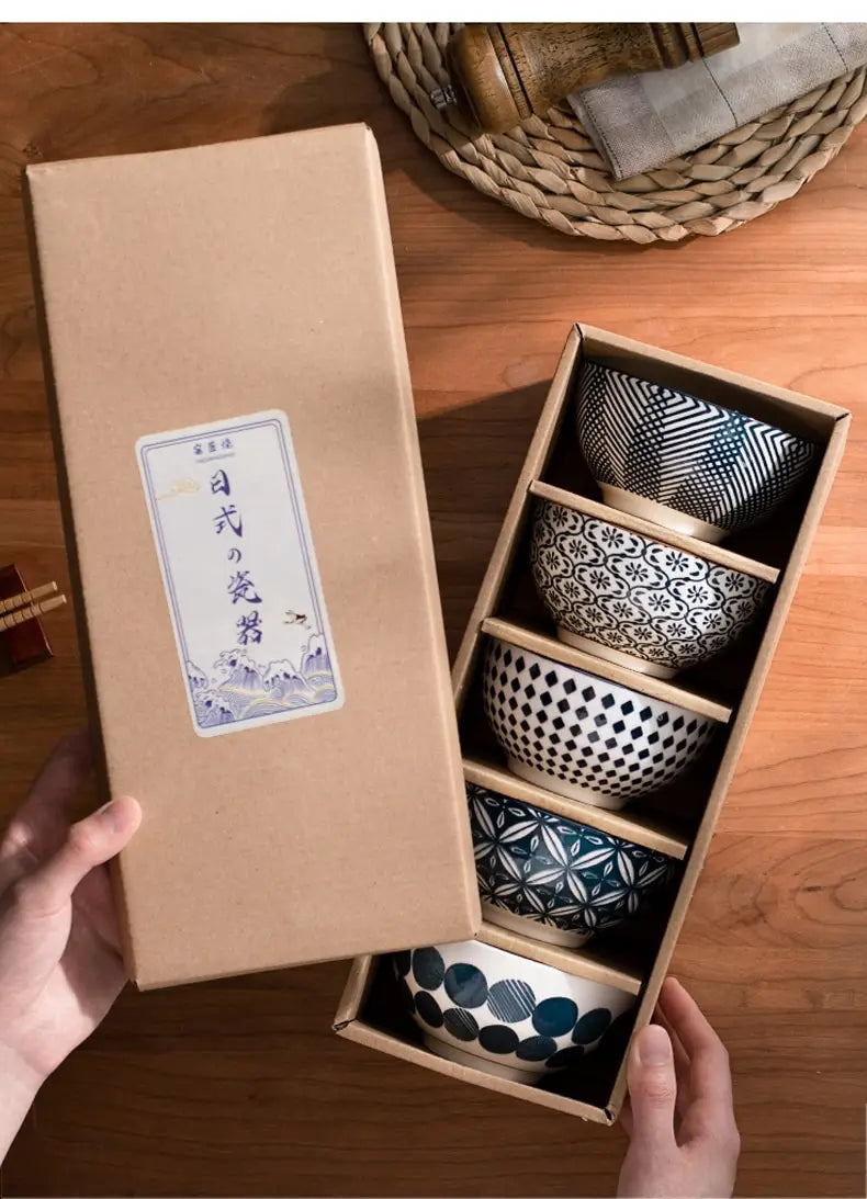 Set of five Japanese ceramic bowls featuring unique black white and blue geometric patterns on glazed porcelain presented in a wooden gift box as part of a ceramic bowl set 5 piece Japanese floral porcelain.