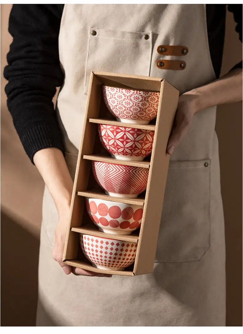 Set of five ceramic bowls with red and white geometric patterns made of porcelain, neatly arranged in a wooden display box in a ceramic bowl set 5 piece Japanese floral porcelain.