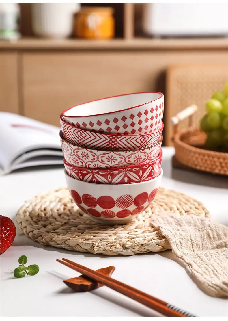 Stack of five red and white ceramic bowls with intricate geometric patterns from the ceramic bowl set 5 piece Japanese floral porcelain.