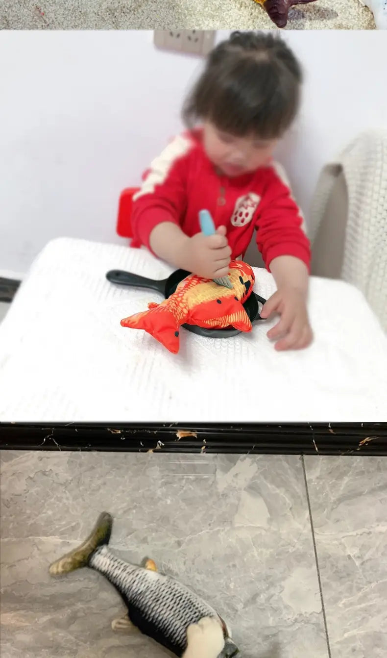 Orange plush electric cat fish toy with usb charging and beating feature, featuring a black handle and yellow accents, sitting on a white surface.
