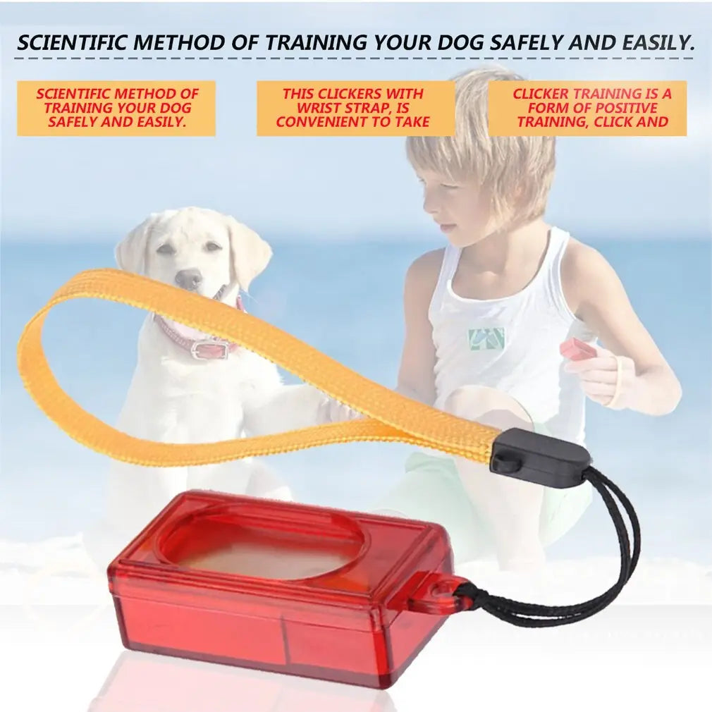Red translucent plastic dog training clicker with a yellow wrist strap and black lanyard used as a pet trainer tool.