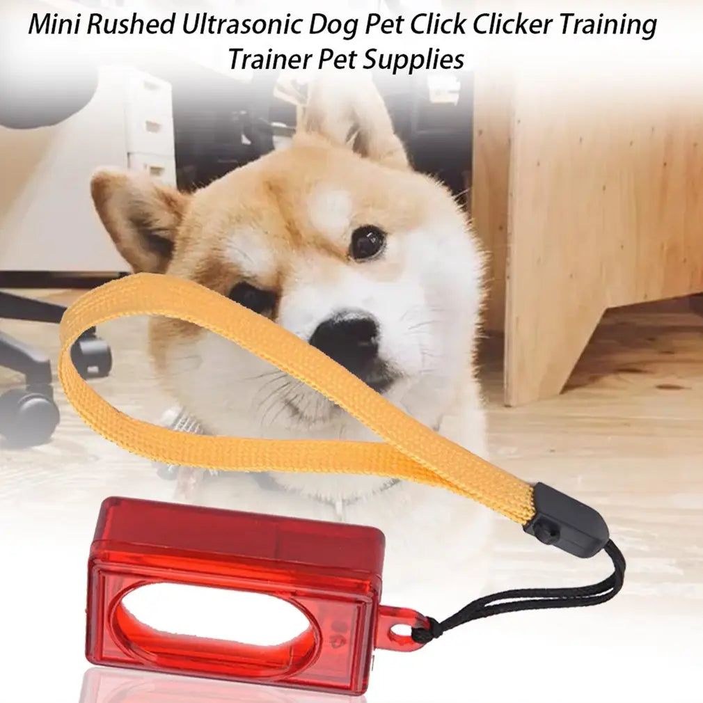Red translucent plastic dog training clicker with yellow fabric strap and black accent for pet training.