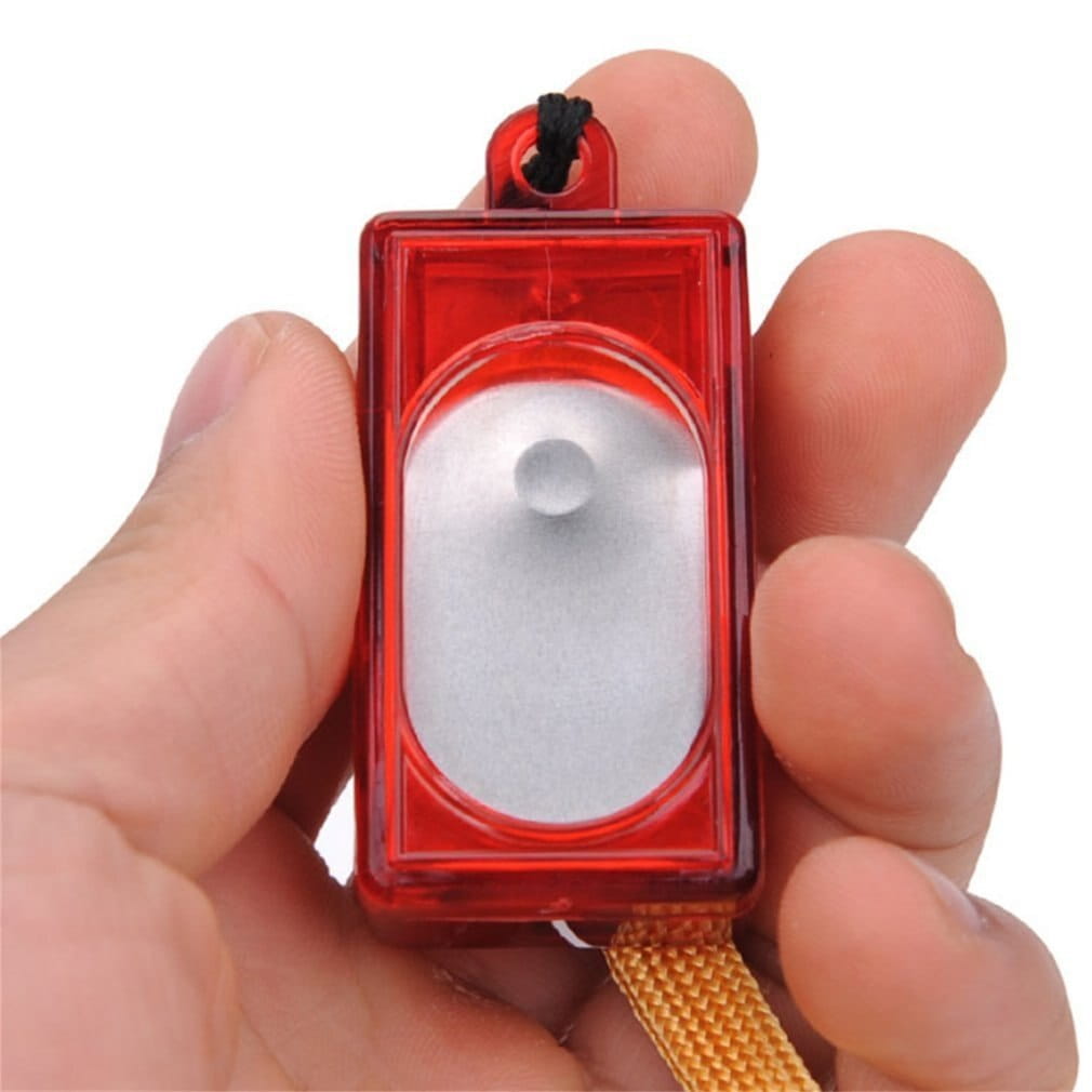 red translucent plastic dog training clicker with a silver-colored internal chamber and black cord loop for easy carrying