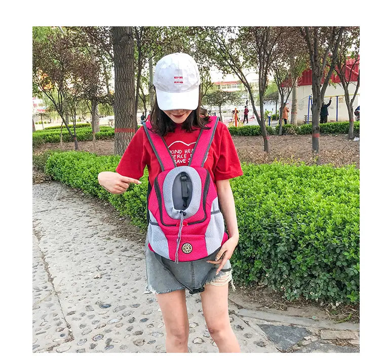 pink and gray breathable mesh pet carrier backpack with mesh panels and a circular zipper closure
