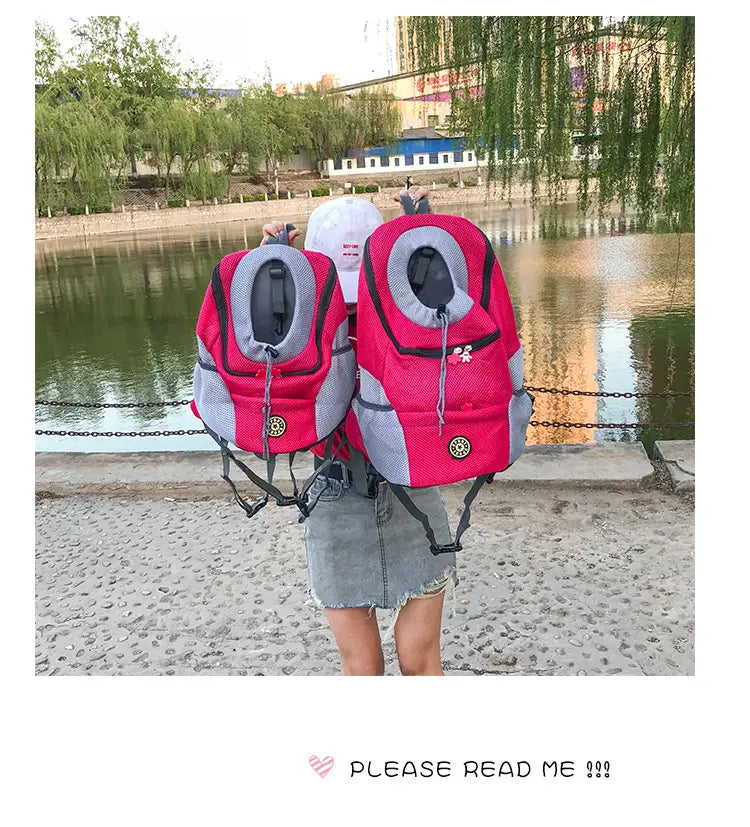Pink and gray breathable mesh pet carrier backpack with a circular logo on the front designed for comfortable pet transport.