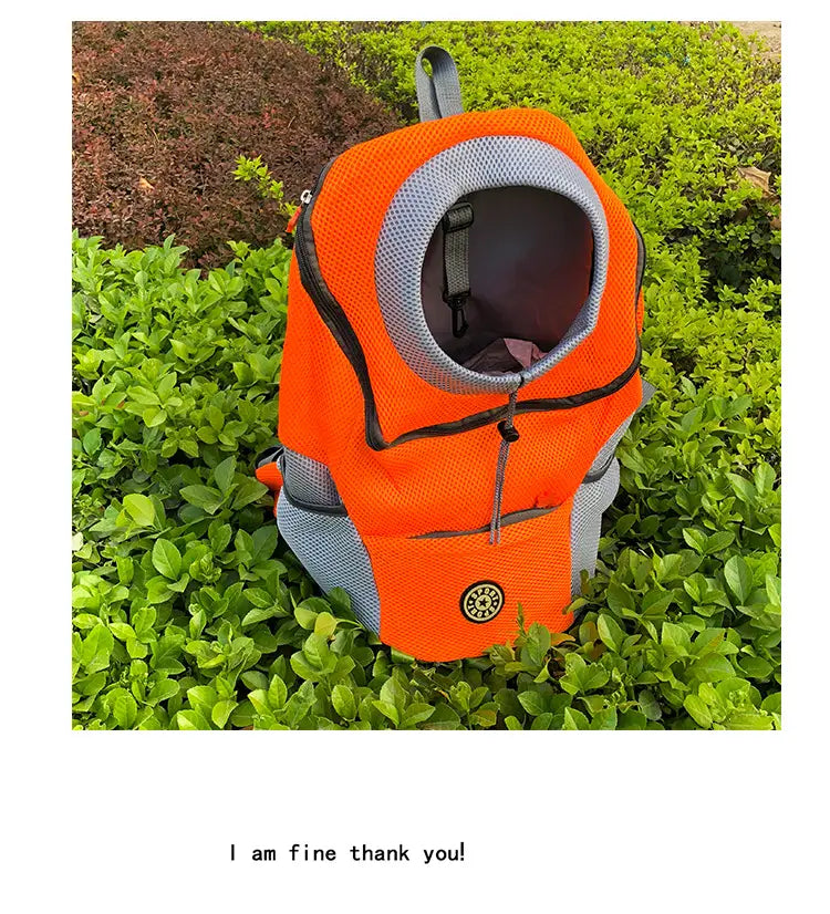 Bright orange and gray breathable mesh pet carrier backpack with a circular opening for the animal’s head