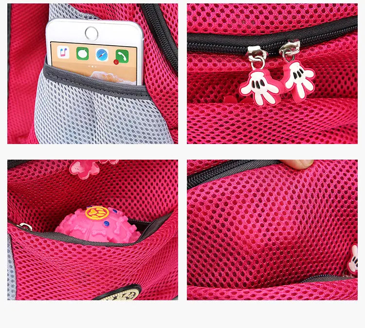 Pink breathable mesh pet carrier backpack with black zippers and playful Mickey Mouse hand-shaped zipper pulls.
