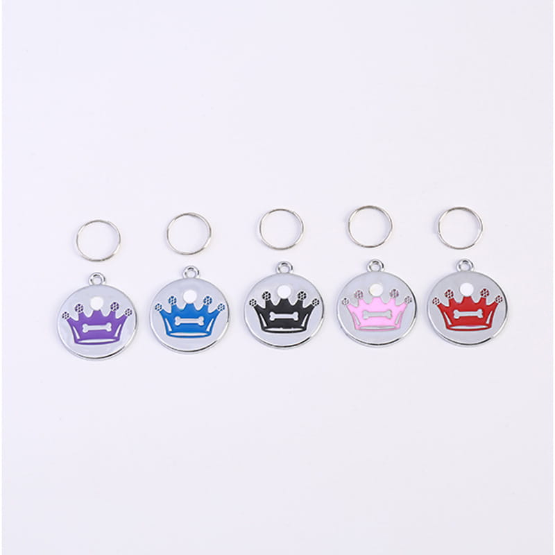 Five circular crown enamel pet id tags in purple blue black pink and red on a silver metallic base with attached key rings in a five pack set.