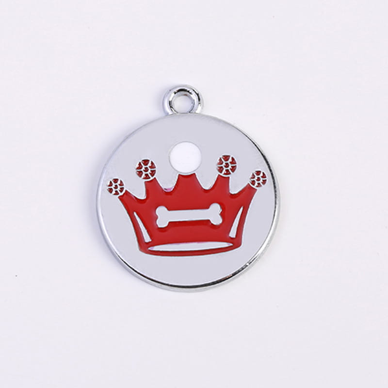 Silver circular pet id tag featuring a red enamel crown with a white bone in the center and decorative red dots on each point from the crown enamel pet id tag 5 pack.