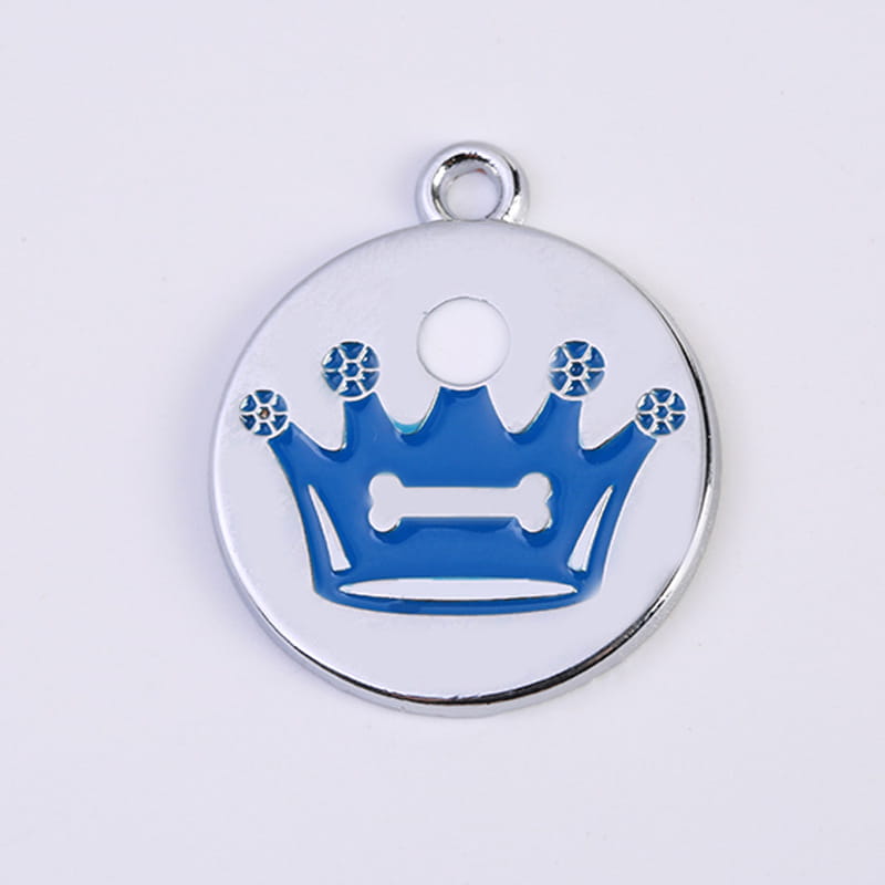 Silver circular pet id tag from the crown enamel pet id tag 5 pack featuring a blue enamel crown design with five gemstone accents and a central bone shape.