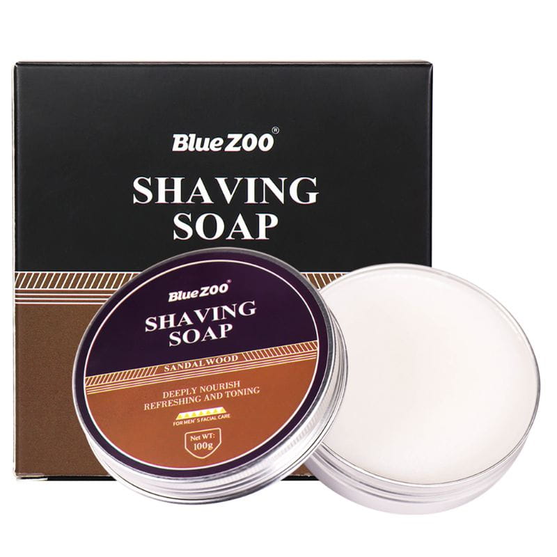 Bluezoo Rasierseife für Männer: feuchtigkeitsspendende Sandelholz-Minz-Creme in einer klaren runden Dose mit einem violetten und braunen Etikett mit 100 g des weißen, cremigen Produkts.