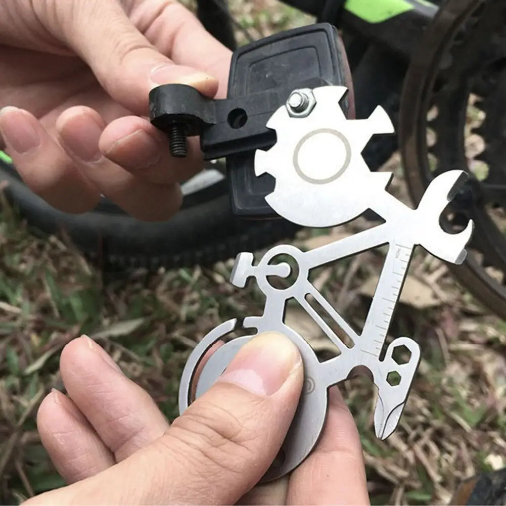 silver bicycle multi-tool made of 420 steel with mirror and ruler features including gear wrench and screwdriver shapes for repair use