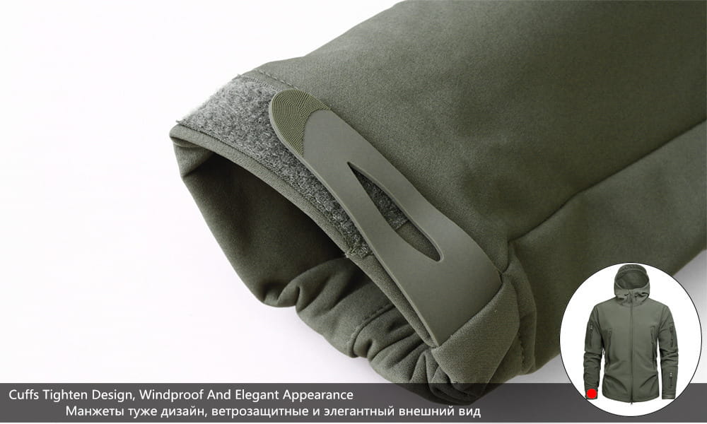 Olive green tactical waterproof softshell fleece jacket cuff with gray plastic tab for adjustable tightening.