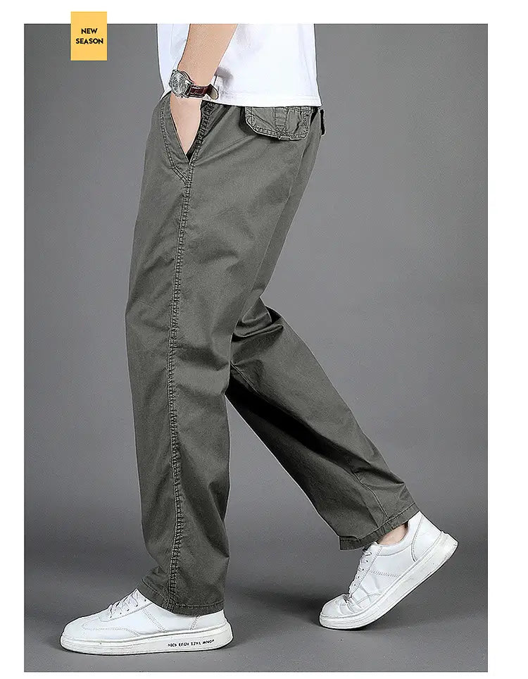 olive green men cargo pants with multiple pockets and a relaxed fit made of cotton for casual wear