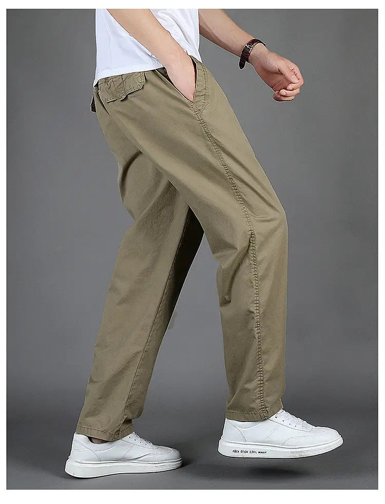 Men cargo pants casual relaxed fit cotton trousers in khaki color with visible stitching and side pockets.