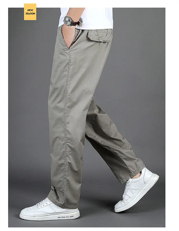 Men cargo pants casual relaxed fit cotton trousers in khaki color with multiple pockets and visible stitching details.