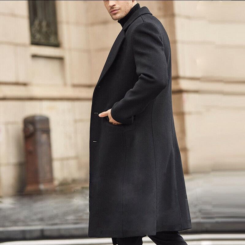 A sleek black wool men’s trench coat featuring a classic double-breasted design and notched lapels.